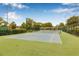 Well-maintained tennis court surrounded by lush landscaping in a beautiful community setting at 501 E Bay Dr # 802, Largo, FL 33770