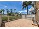 Enjoy the outdoors on this unit's private, screened patio with view of the palm trees and other lush landscaping at 5030 Herring Ct, New Port Richey, FL 34652