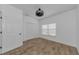 Bright bedroom with closet, light colored plank flooring, and neutral wall color at 5030 Herring Ct, New Port Richey, FL 34652
