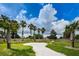 This community features a park area with walking paths, benches, and well-maintained landscaping at 5030 Herring Ct, New Port Richey, FL 34652