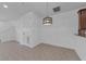 Bright dining area with neutral tile flooring, stylish light fixture, and ample space for entertaining at 5030 Herring Ct, New Port Richey, FL 34652