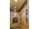 Modern elevator with wooden interior, mirrored accents, and functional handrail for accessibility at 5030 Herring Ct, New Port Richey, FL 34652