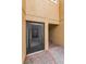 Covered townhome entrance with black screen door and brick paver walkway, creating an inviting welcome at 5030 Herring Ct, New Port Richey, FL 34652