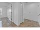 Hallway with tile flooring, and multiple closet options at 5030 Herring Ct, New Port Richey, FL 34652