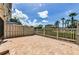 Spacious paved patio area with a view of the surrounding lawn and landscaping at 5030 Herring Ct, New Port Richey, FL 34652