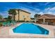 Community pool area offering ample lounging space, blue water, and a nearby cabana for relaxation and shade at 5030 Herring Ct, New Port Richey, FL 34652