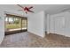 Sunroom with brick flooring and sliding glass doors at 5030 Herring Ct, New Port Richey, FL 34652