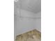 Walk-in closet with tile flooring and ample shelving space at 5030 Herring Ct, New Port Richey, FL 34652