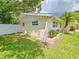 Well-maintained backyard with lush green grass and newer white privacy fence at 5102 Peacock, Holiday, FL 34690