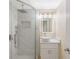 This bathroom boasts a sleek glass-enclosed shower, modern vanity, and contemporary fixtures at 5102 Peacock, Holiday, FL 34690