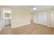 Bedroom with light walls, wood-look floors, and large closets at 5102 Peacock, Holiday, FL 34690