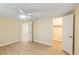 Bright bedroom with light colored walls, and light-colored wood-look floors at 5102 Peacock, Holiday, FL 34690