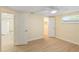Bright bedroom with a ceiling fan, wood floors, and a closet at 5102 Peacock, Holiday, FL 34690