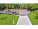 Charming single-story home with lush landscaping and a two-car garage at 5102 Peacock, Holiday, FL 34690