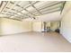 Spacious, well-lit garage with painted floor, ample storage, and mechanical equipment at 5102 Peacock, Holiday, FL 34690