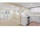 A partial kitchen with stainless steel dishwasher, wood floor, and view to back door at 5102 Peacock, Holiday, FL 34690