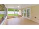 Screened lanai with access to backyard through sliding glass doors at 5102 Peacock, Holiday, FL 34690