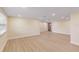 The spacious living room with modern lighting features sleek, wood-look flooring at 5102 Peacock, Holiday, FL 34690
