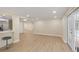 Open floor plan with wood look flooring and views to patio with pool at 5102 Peacock, Holiday, FL 34690