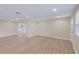 The open-concept living room features sleek wood-look flooring and neutral paint at 5102 Peacock, Holiday, FL 34690
