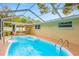Refreshing pool with a screened enclosure in a spacious backyard at 5102 Peacock, Holiday, FL 34690