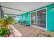 Tiled, covered patio is the perfect space for relaxing outside while at home at 5107 Pine St, Seffner, FL 33584