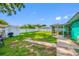 Large backyard featuring a screened-in patio, storage shed, and well-maintained lawn at 5107 Pine St, Seffner, FL 33584