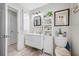 Modern bathroom features a stylish vanity with white cabinets, and sleek fixtures at 5107 Pine St, Seffner, FL 33584