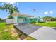 Charming one-story home with covered parking, a well-maintained lawn, and inviting curb appeal at 5107 Pine St, Seffner, FL 33584