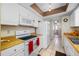 Functional kitchen featuring white appliances, tile flooring, and wood countertops at 5107 Pine St, Seffner, FL 33584
