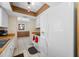 Bright kitchen featuring white appliances, tile flooring and wood countertop at 5107 Pine St, Seffner, FL 33584