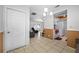 Open floor plan with tile flooring connecting the living, dining, and kitchen areas at 5107 Pine St, Seffner, FL 33584