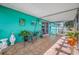 Screen room featuring tile flooring with plants and seating area at 5107 Pine St, Seffner, FL 33584