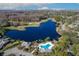 A high angle view showcases the pool with a lake and golf course in the background at 5340 Cobblestone Ct, Wesley Chapel, FL 33543