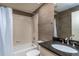 Well-lit bathroom featuring a shower and bathtub combination with sleek, modern fixtures at 5340 Cobblestone Ct, Wesley Chapel, FL 33543