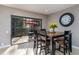 Dining area with wooden table, seating for four, and sliding glass doors offering natural light and outdoor views at 5340 Cobblestone Ct, Wesley Chapel, FL 33543