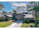 Stunning exterior view of the property featuring lush landscaping and a well-maintained driveway at 5340 Cobblestone Ct, Wesley Chapel, FL 33543