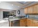 Bright kitchen featuring granite countertops, tile backsplash, stainless steel appliances, and outdoor access at 5340 Cobblestone Ct, Wesley Chapel, FL 33543