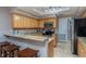 Well-lit kitchen featuring granite countertops, stainless steel appliances, and tile flooring at 5340 Cobblestone Ct, Wesley Chapel, FL 33543