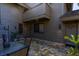Outdoor patio area with stone flooring, complete with a table and chairs for relaxing or entertaining guests at 5340 Cobblestone Ct, Wesley Chapel, FL 33543