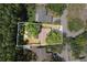 Aerial view showcasing the property layout, mature trees, and surrounding neighborhood at 5346 Black Pine Dr, Tampa, FL 33624