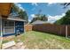 This fenced backyard includes an outdoor water hose and room for playing at 5346 Black Pine Dr, Tampa, FL 33624