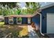 Close up of front exterior showing front door, window boxes and colorful plants at 5346 Black Pine Dr, Tampa, FL 33624