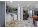 Spacious kitchen that opens to the laundry room featuring stainless steel appliances and wood cabinets at 5346 Black Pine Dr, Tampa, FL 33624