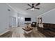 Spacious living room with vaulted ceiling, a sectional sofa, and a large screen TV at 5346 Black Pine Dr, Tampa, FL 33624