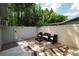 Private fenced patio with outdoor seating and custom deck design offers relaxing outdoor space at 5346 Black Pine Dr, Tampa, FL 33624