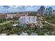 Breathtaking aerial view of the city showcasing the buildings and surrounding streets and mature trees at 700 Beach Ne Dr # 606, St Petersburg, FL 33701