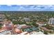 Expansive aerial view showcasing the city's layout, with its buildings, tennis courts, and residential areas at 700 Beach Ne Dr # 606, St Petersburg, FL 33701