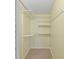 Empty closet with neutral carpet and shelving for ample storage at 700 Beach Ne Dr # 606, St Petersburg, FL 33701