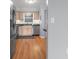 This kitchen features stainless steel appliances and light wood cabinets with black countertops at 700 Beach Ne Dr # 606, St Petersburg, FL 33701
